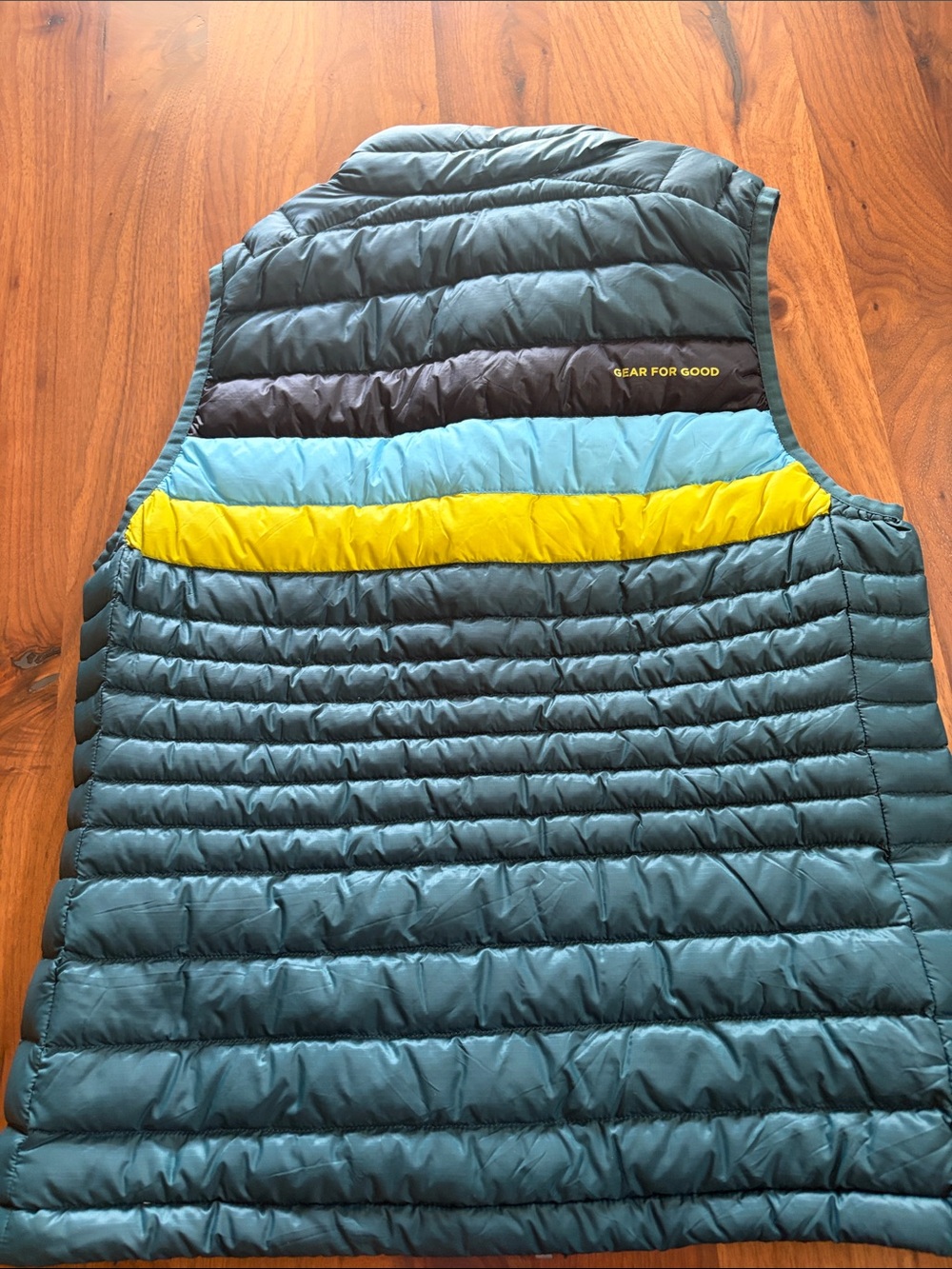 Cotopaxi Teal Puffer Vest with Yellow & Light Blue Stripes - Picture 4 of 4